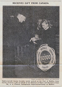 Newspaper clipping of Ausma Levalds being recognized as the 50,000th Displaced Person to arrive in Canada after the Second World War.