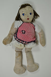 Cloth doll with painted face.