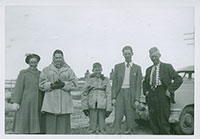 Smith family in their winter coats in July, 1956.